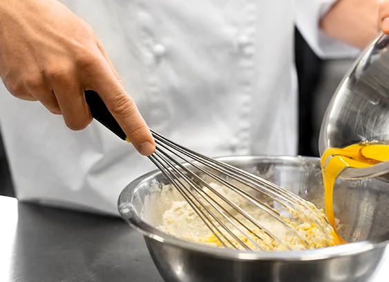 A restaurant chef preparing a dish