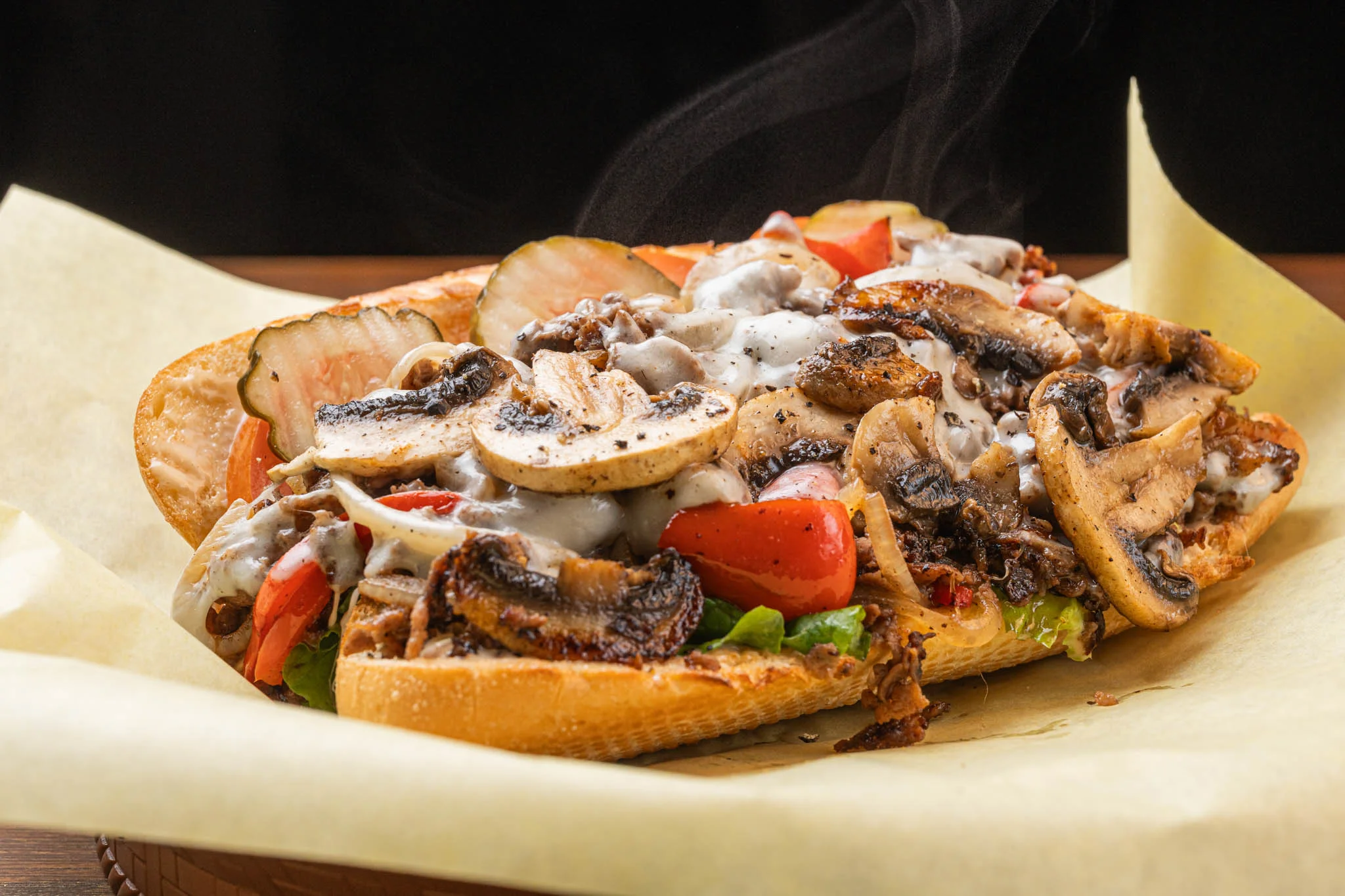 Delicious Mushroom Deluxe Cheesesteak sandwich with melted cheese and mushrooms.