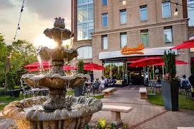 Charming restaurant exterior with fountain and outdoor seating