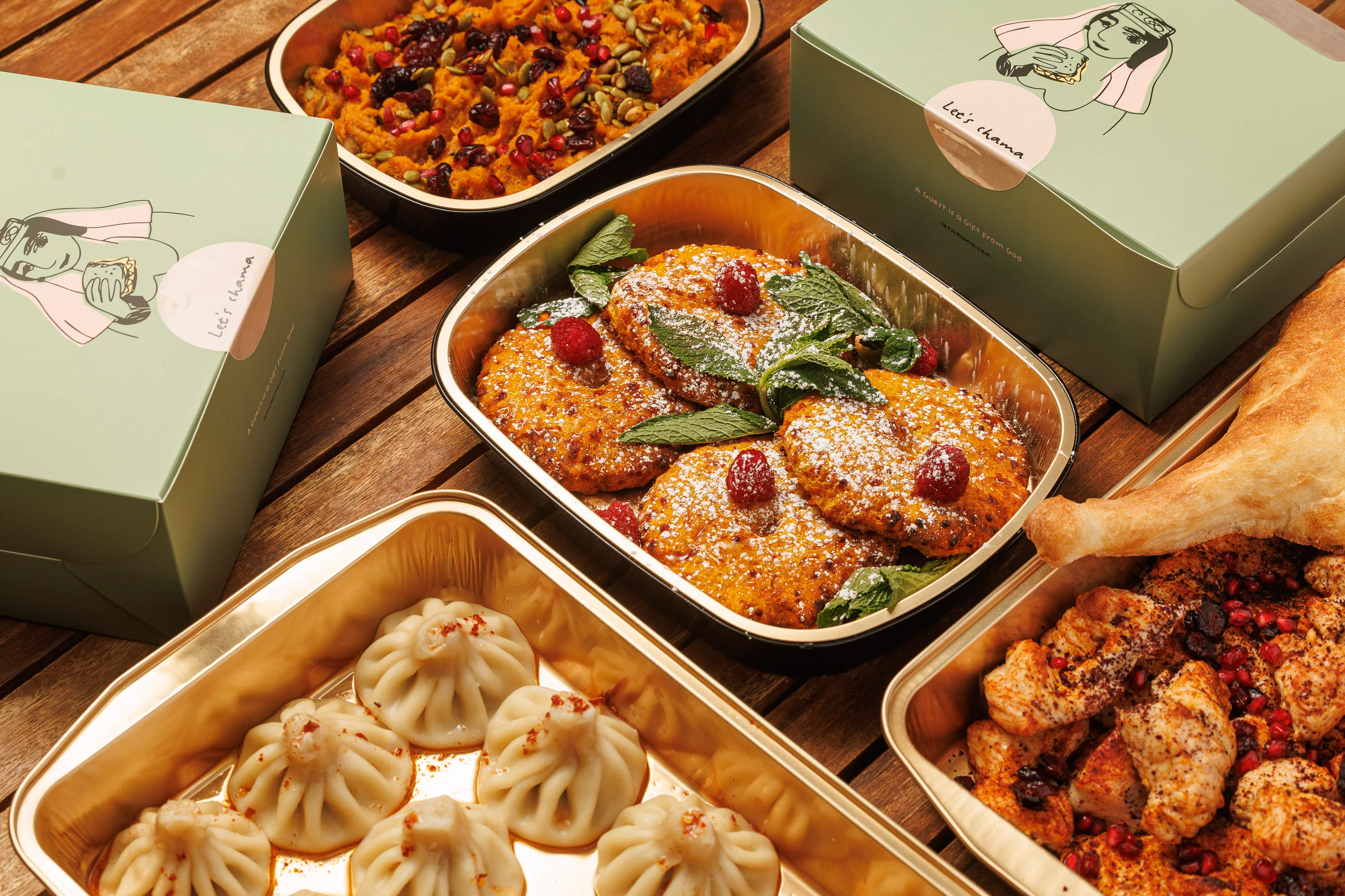Georgian feast with khinkali dumplings and pastries in catering boxes