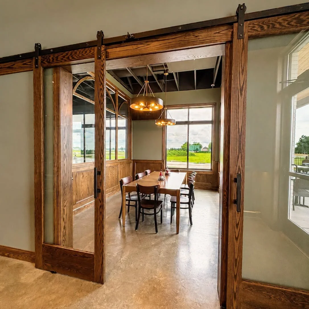 Elegant restaurant dining area with wooden accents and large windows