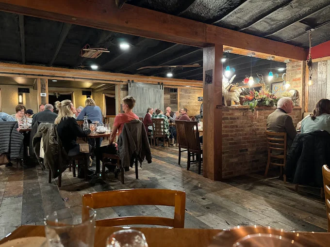 Cozy restaurant interior with warm lighting and rustic decor
