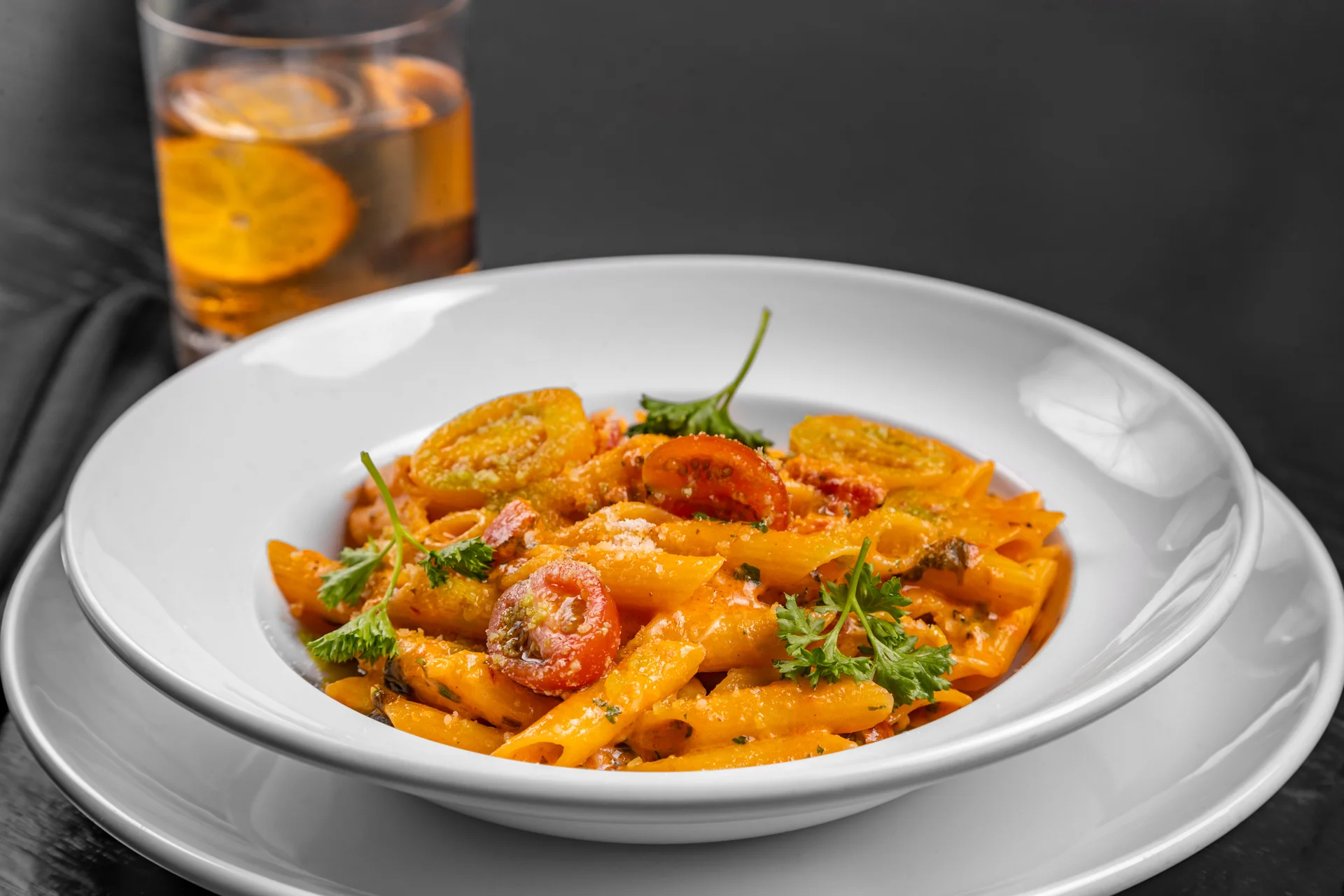 Penne arrabbiata pasta garnished with herbs