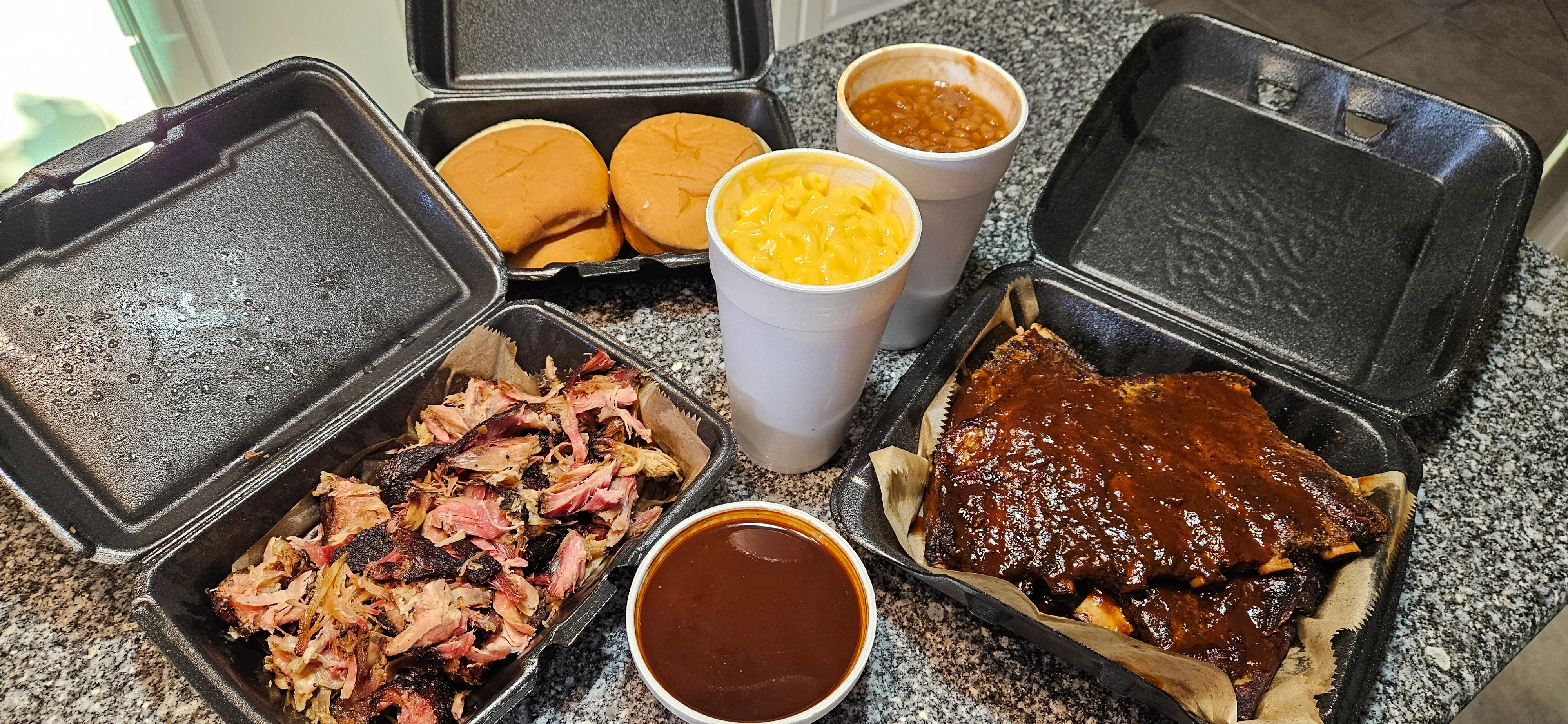 Barbecue platter featuring pulled pork and ribs