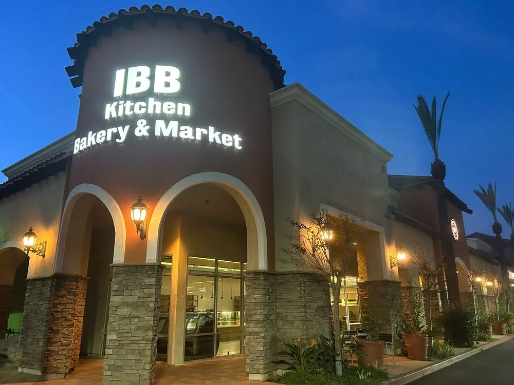 Exterior view of IBB Kitchen Bakery & Market at dusk