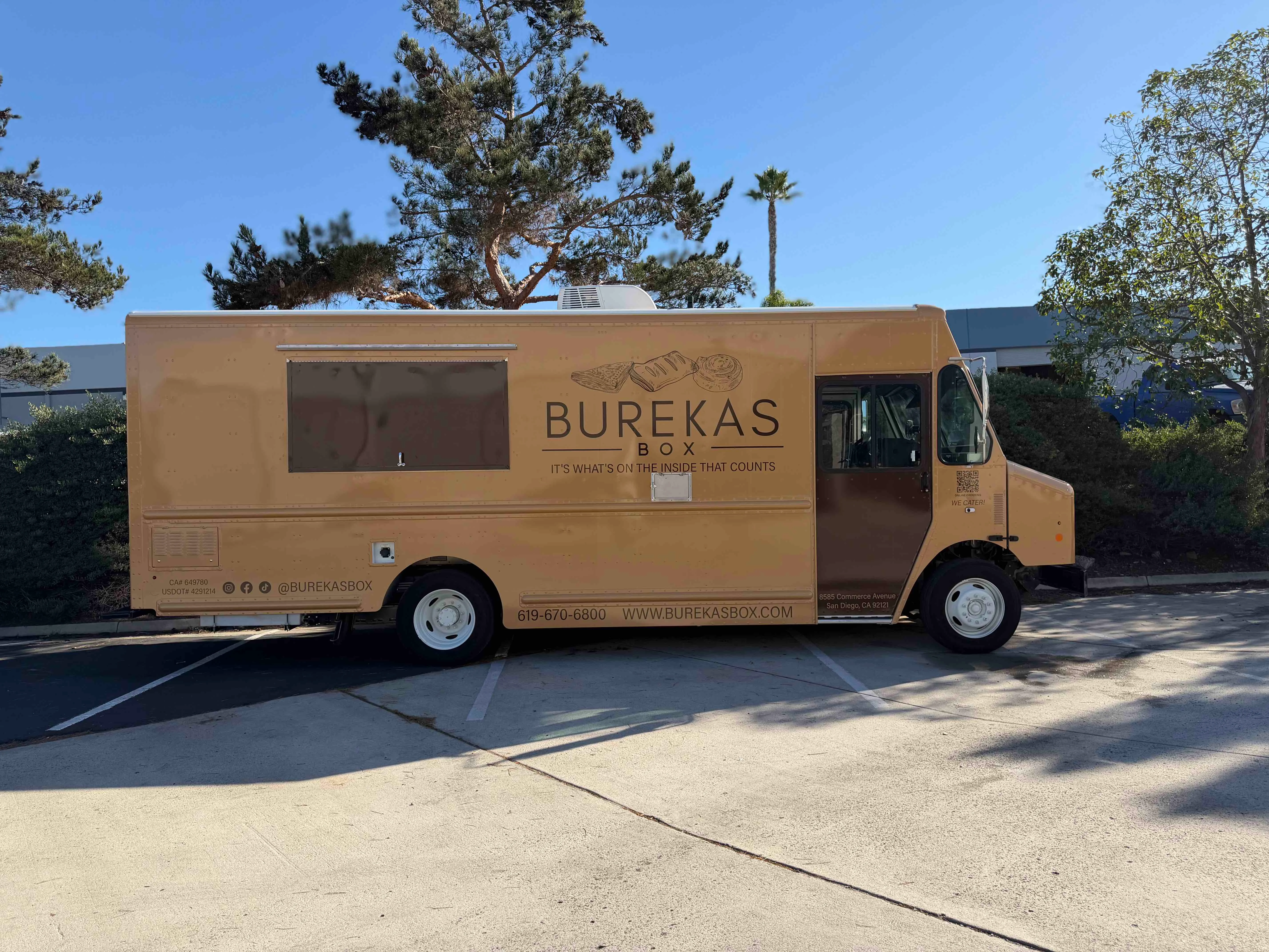 Burekas food truck parked in a sunny location
