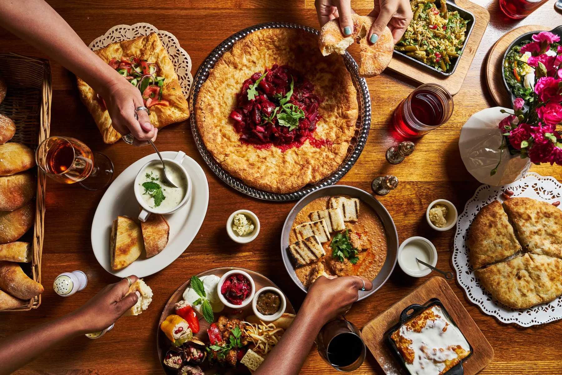 Friends sharing a Georgian feast at Chama Mama