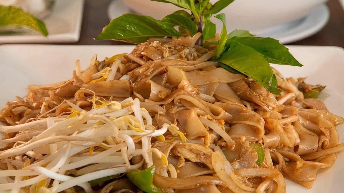 Delicious Pad See Ew with wide rice noodles and fresh basil