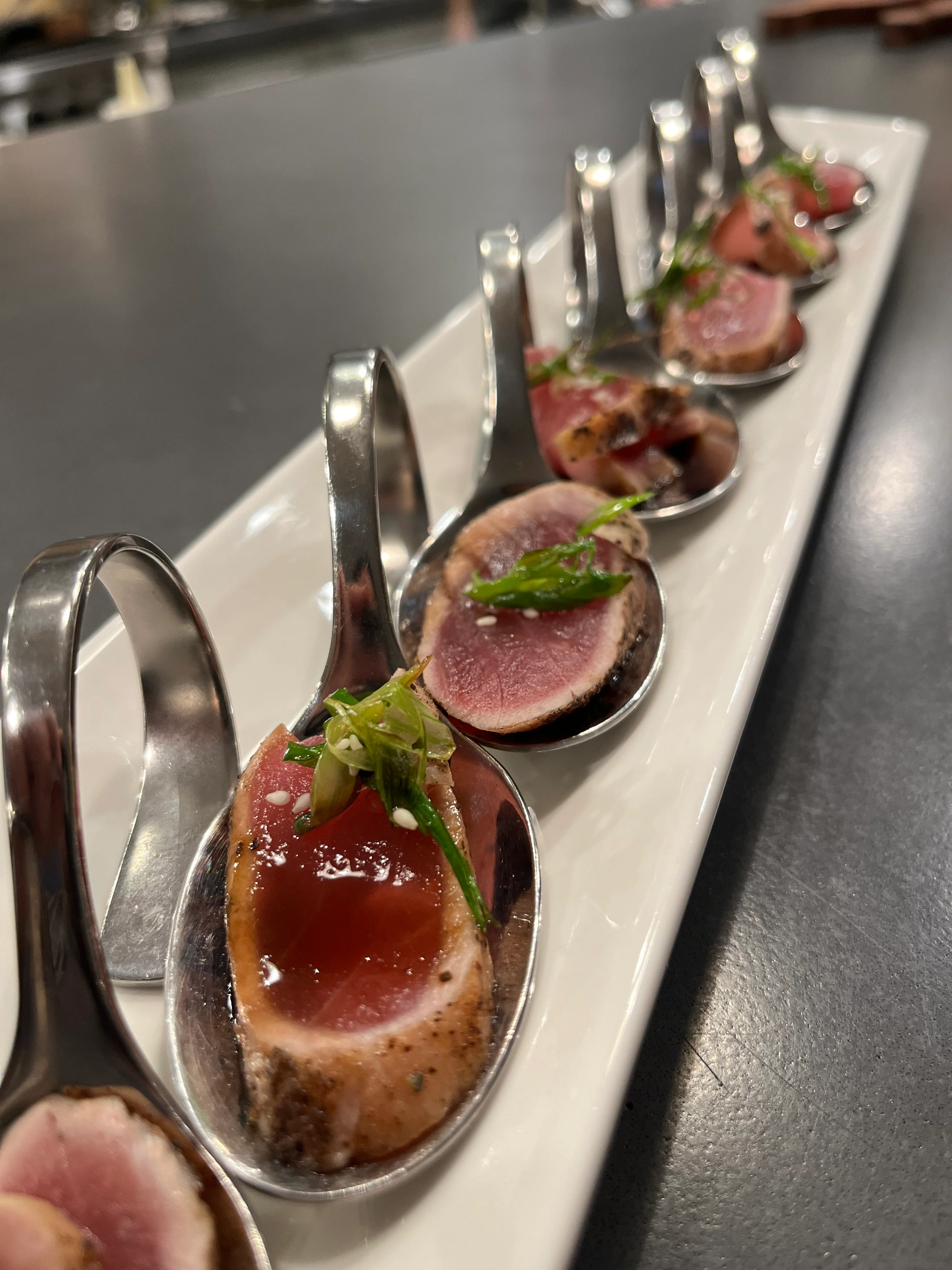 Seared tuna sashimi served in tasting spoons