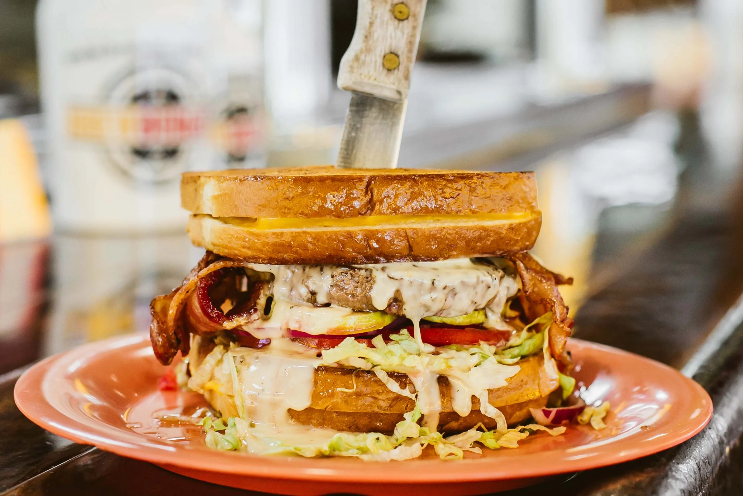 Juicy American cheeseburger stacked high with toppings