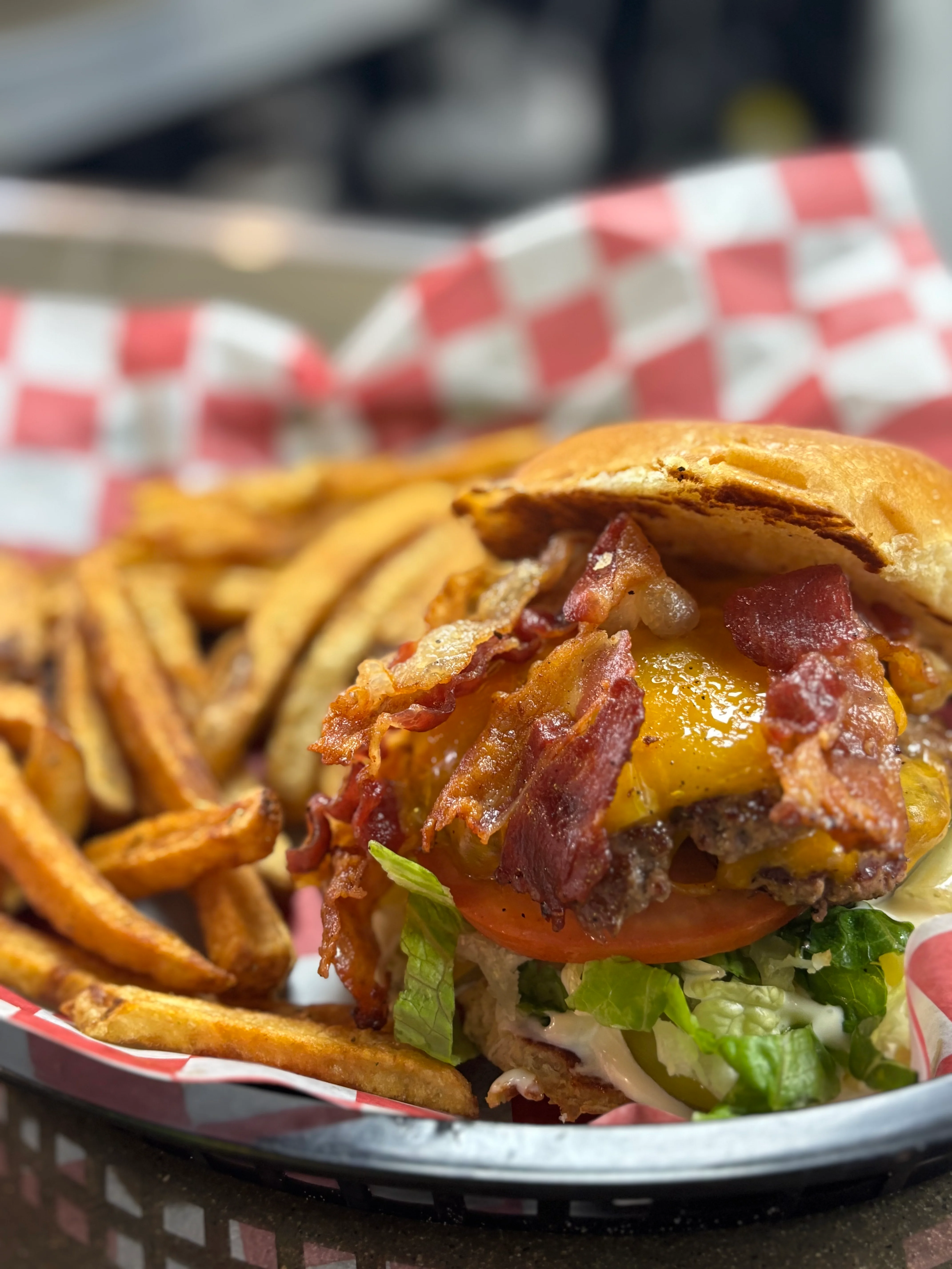 Juicy bacon cheeseburger with fries