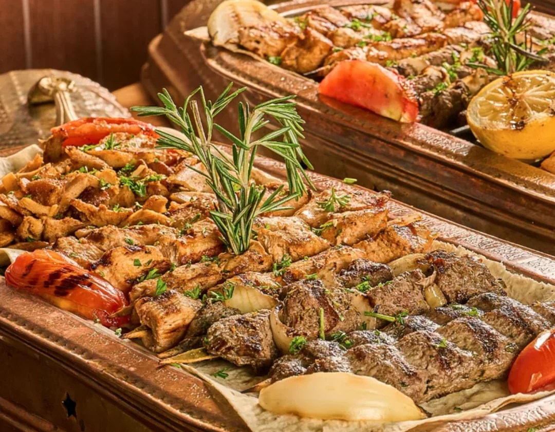 Delicious shawarma platter with fresh vegetables and sauces