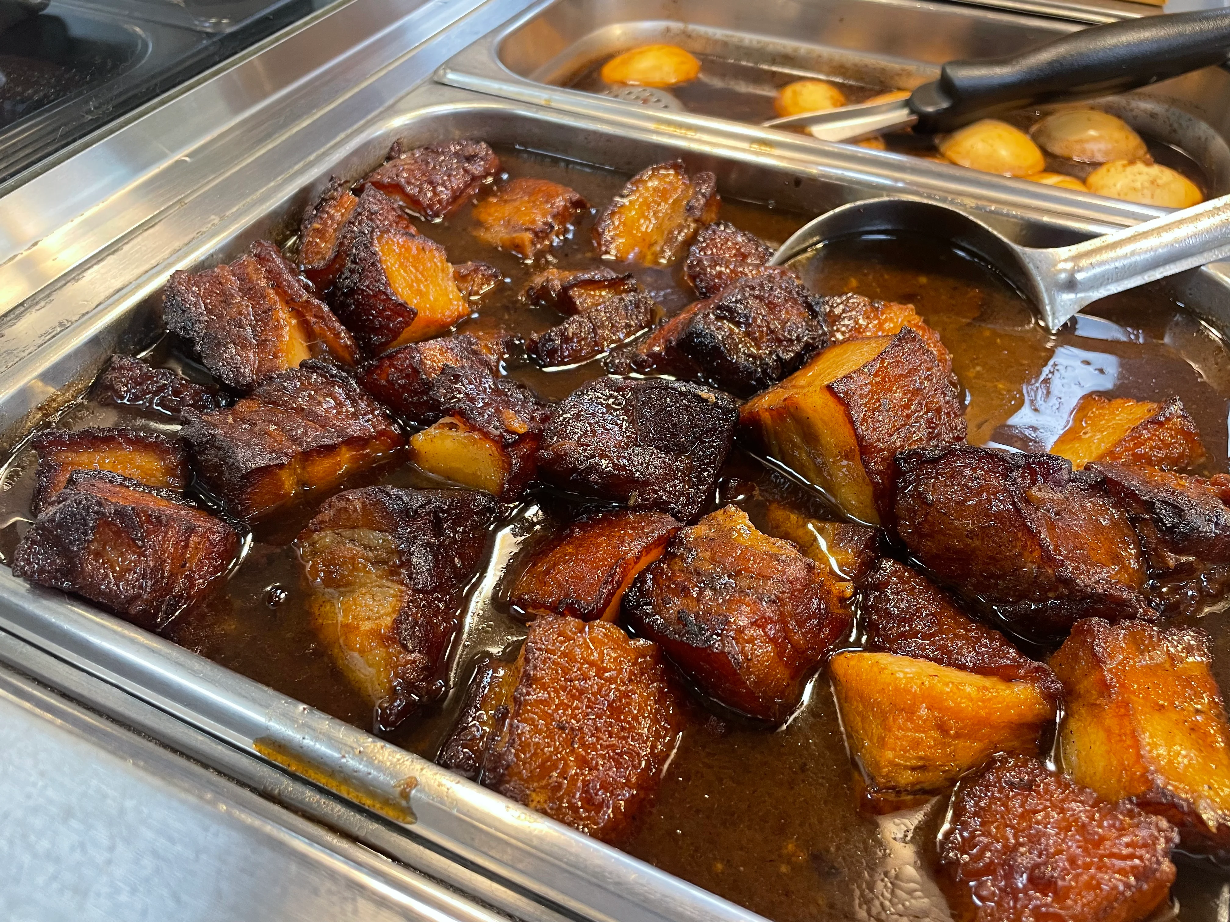 Nigerian jollof rice with fried plantains in rich sauce