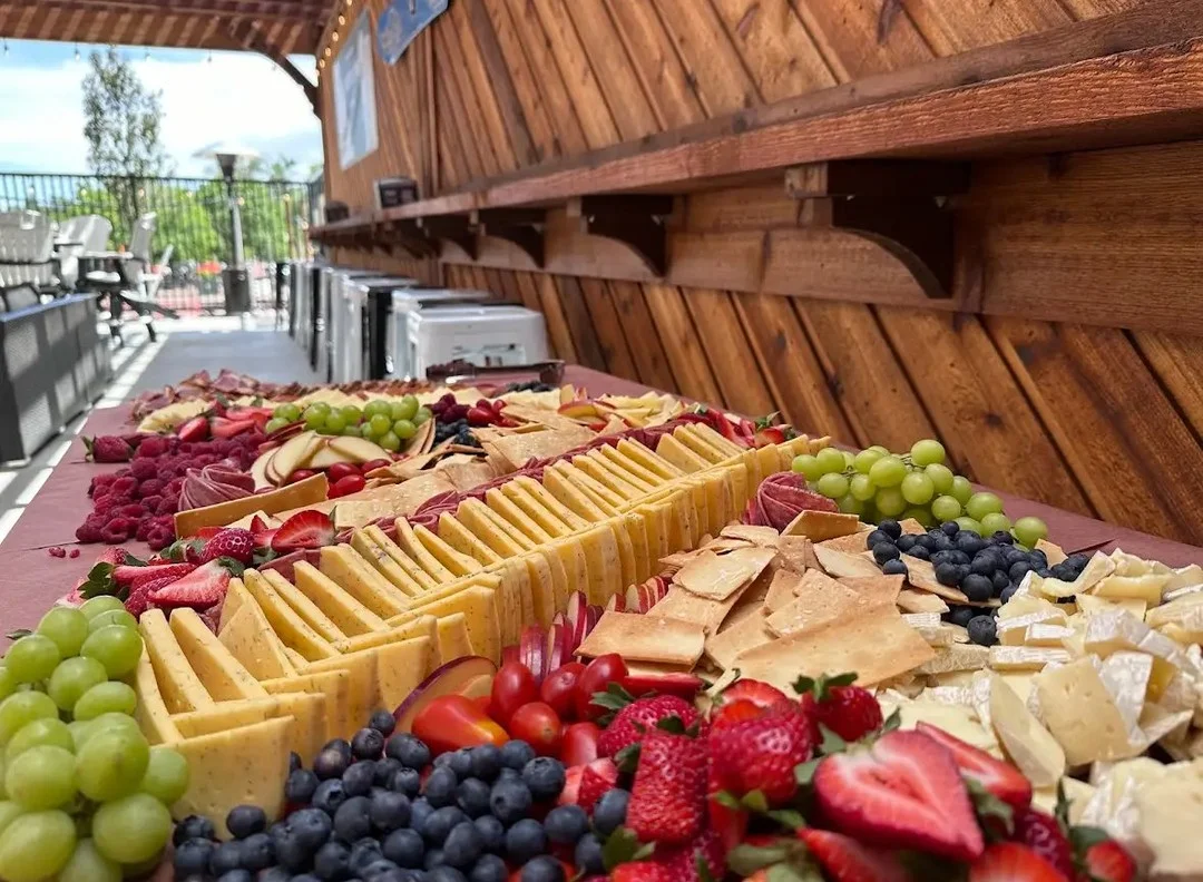 Artisan cheese and charcuterie board with fresh fruits