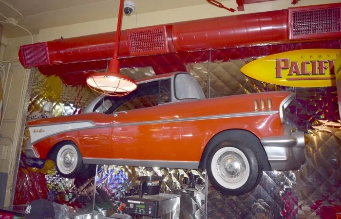 Vintage car decor in a lively restaurant interior