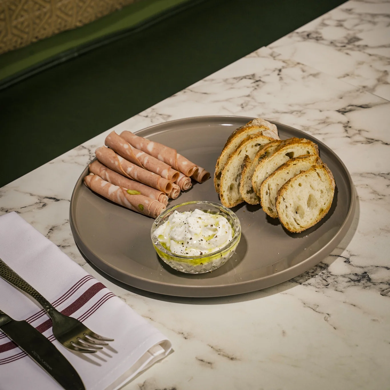 Italian antipasto platter with cured meats and bread