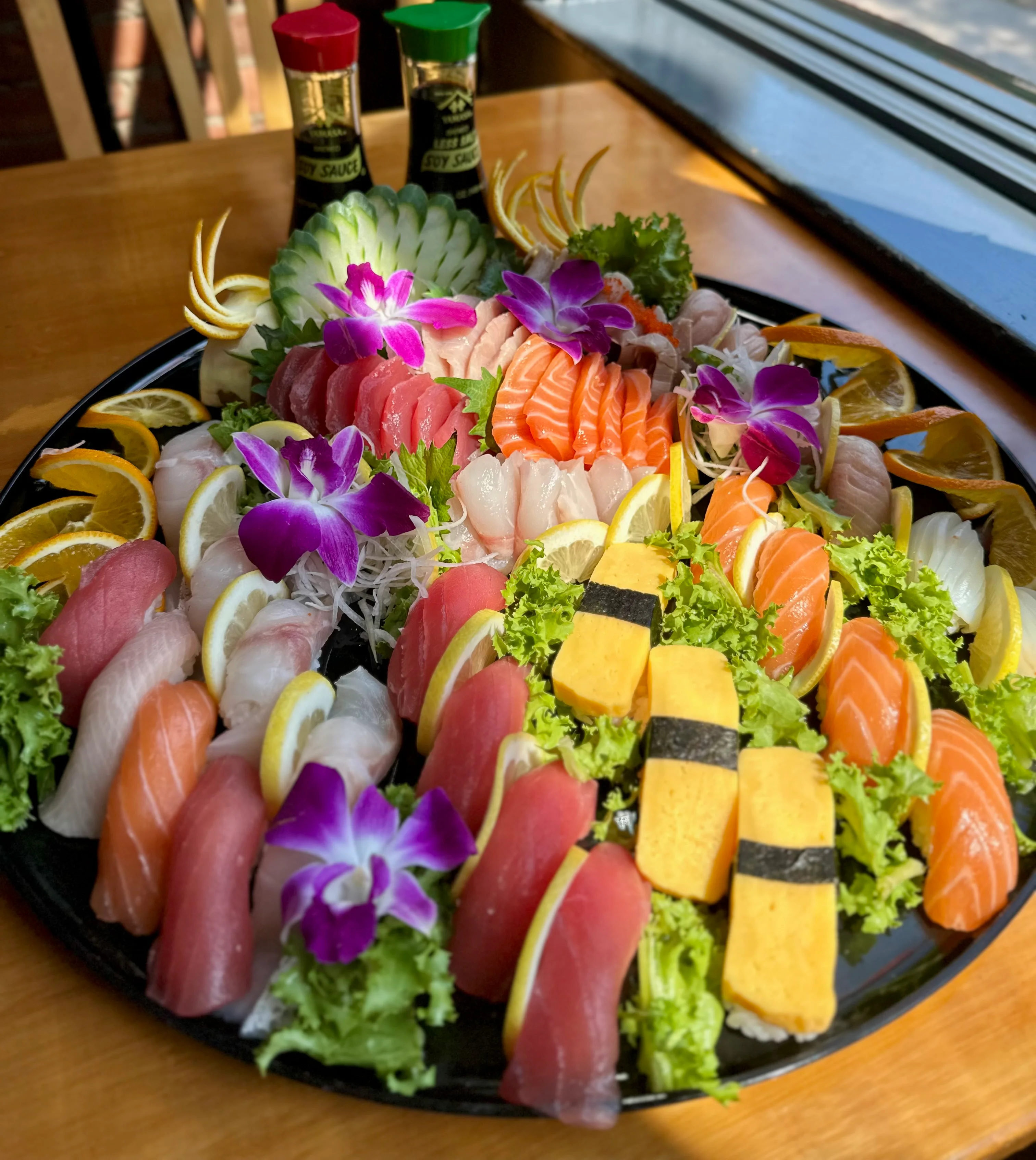 Assorted Japanese sushi platter with fresh fish and garnishes