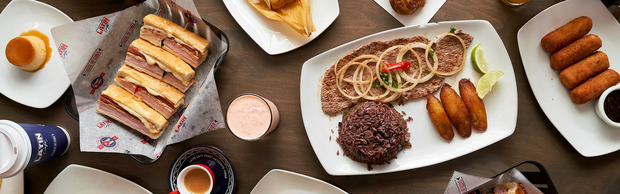 Cuban ropa vieja with rice and plantains on a restaurant table