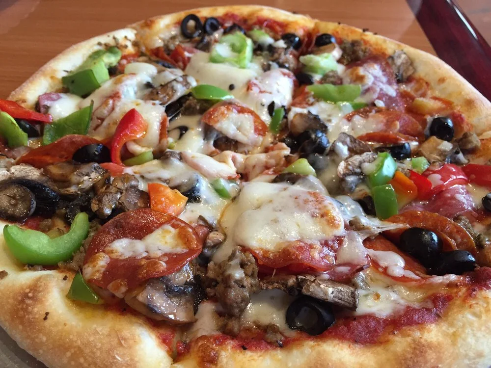 Loaded pepperoni pizza with vegetables