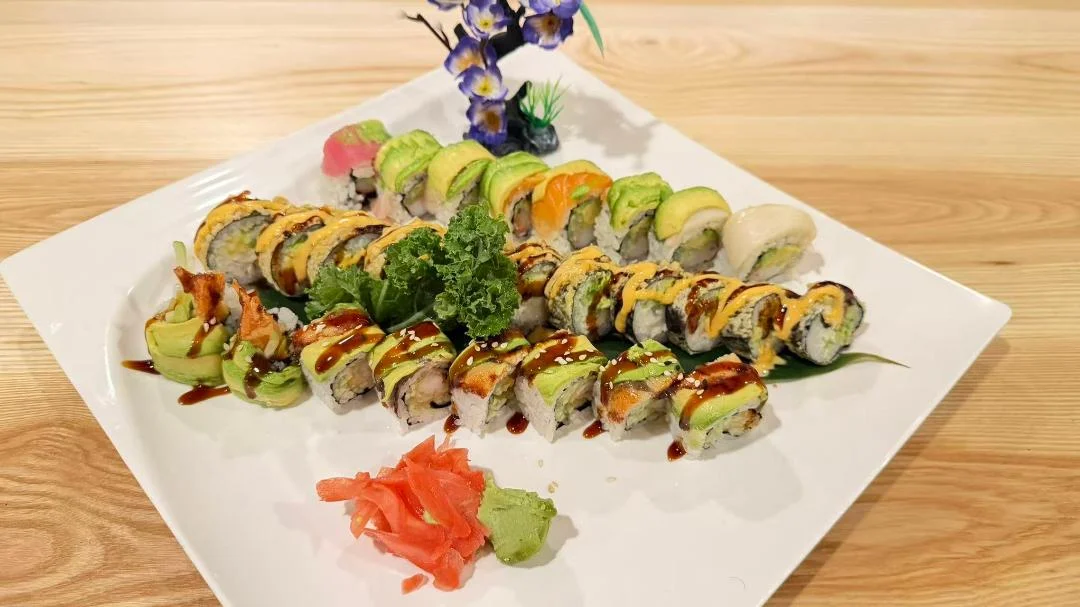 Assorted sushi platter featuring colorful rolls