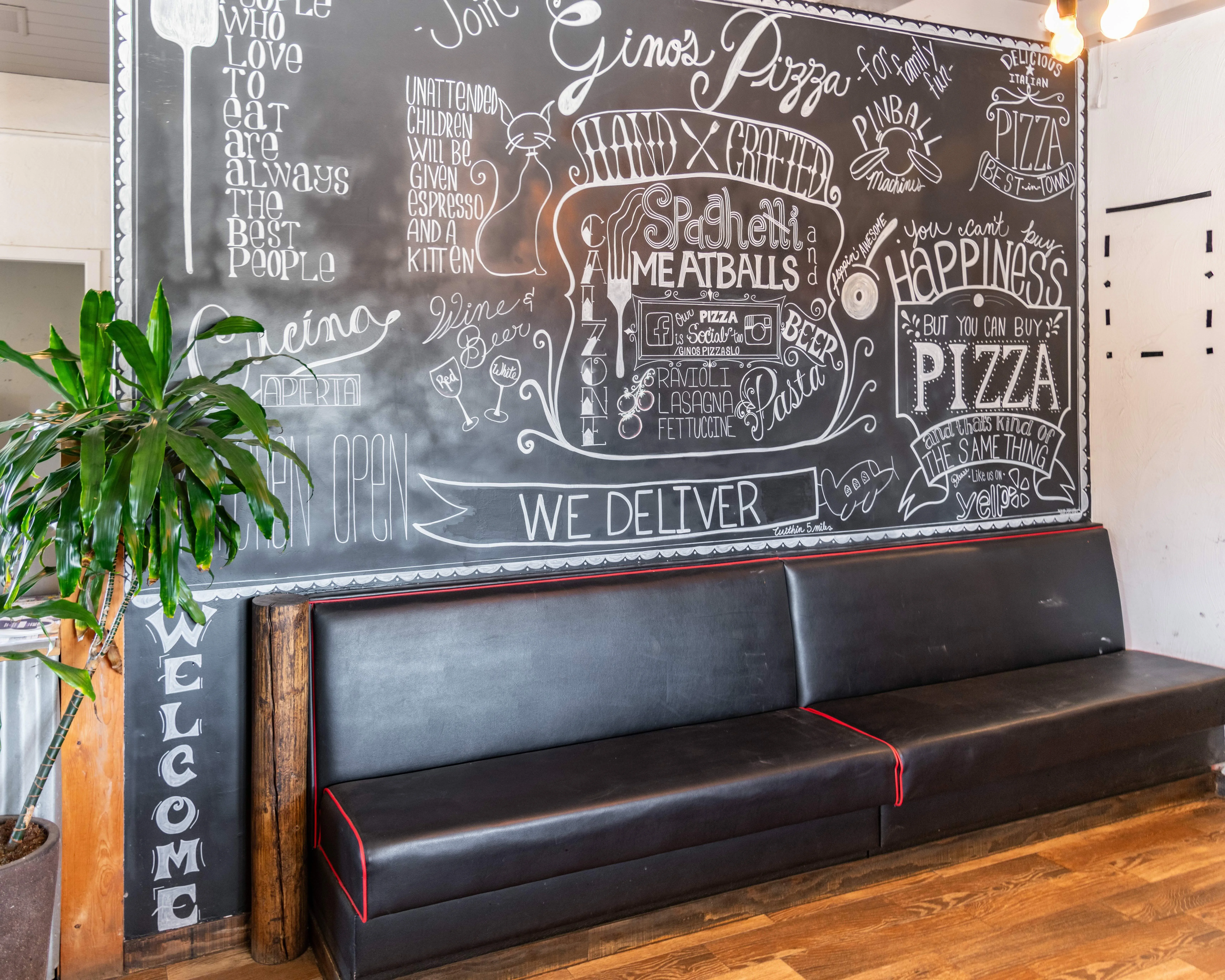 Cozy restaurant interior with chalkboard menu and seating area