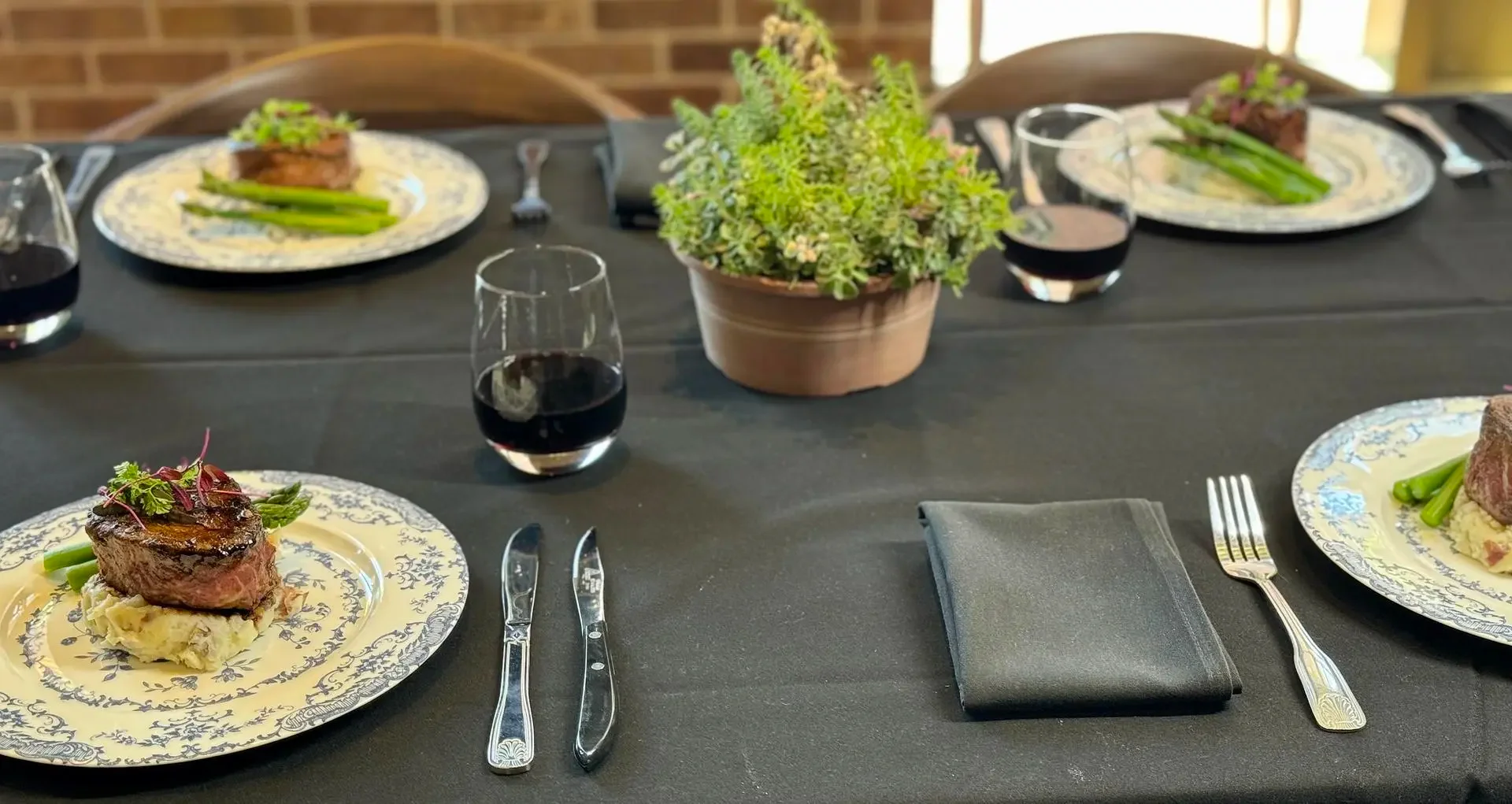 Grilled filet mignon with asparagus on a fine dining table