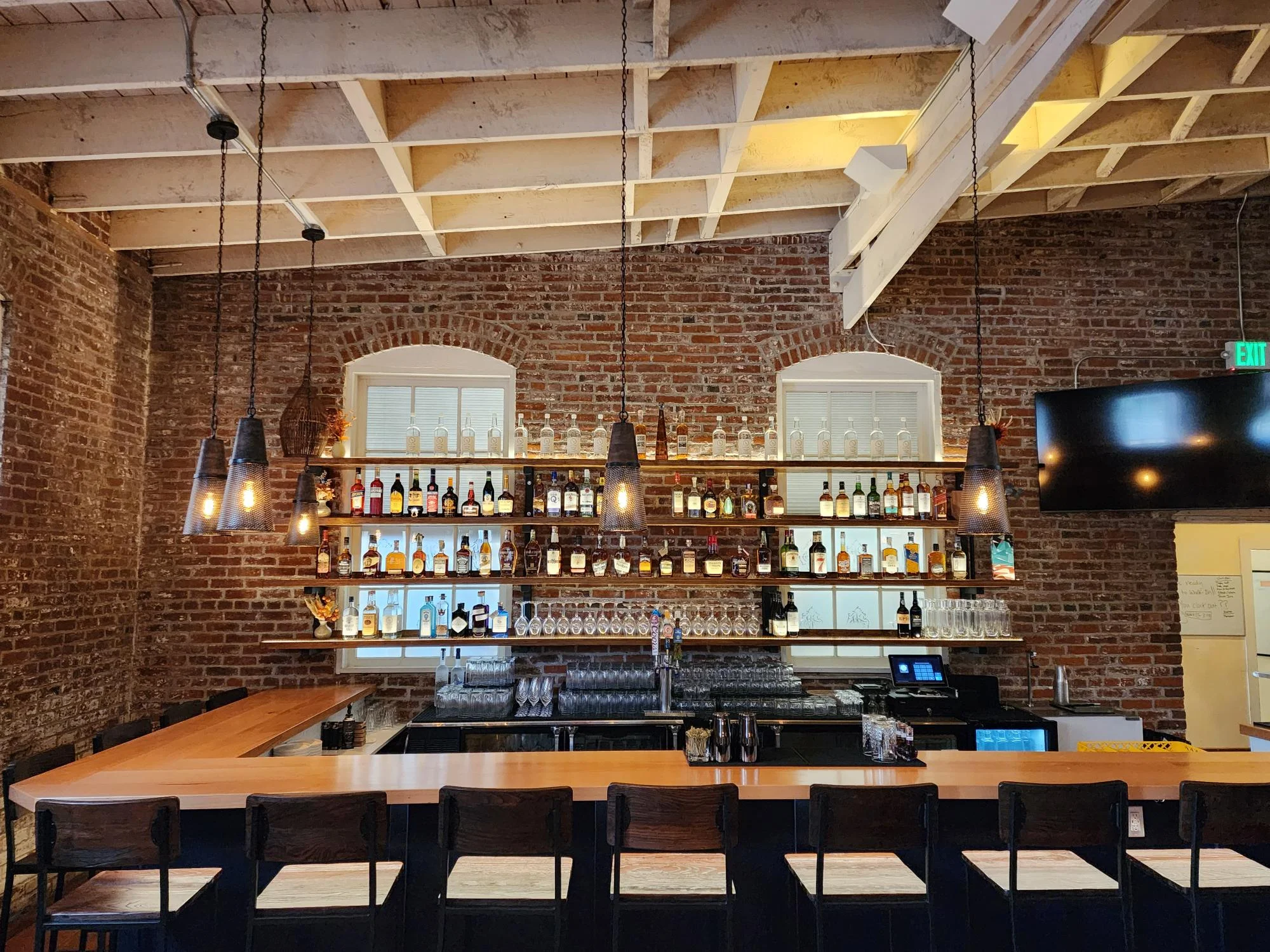 Modern bar interior with exposed brick and stylish lighting