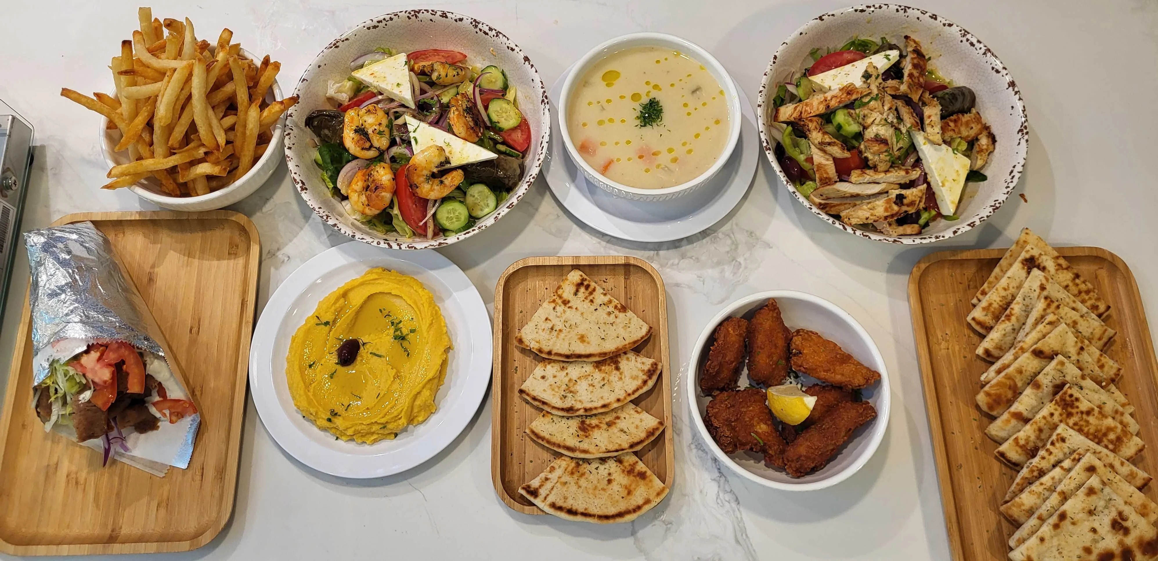 Mediterranean feast with hummus, salads, and grilled meats