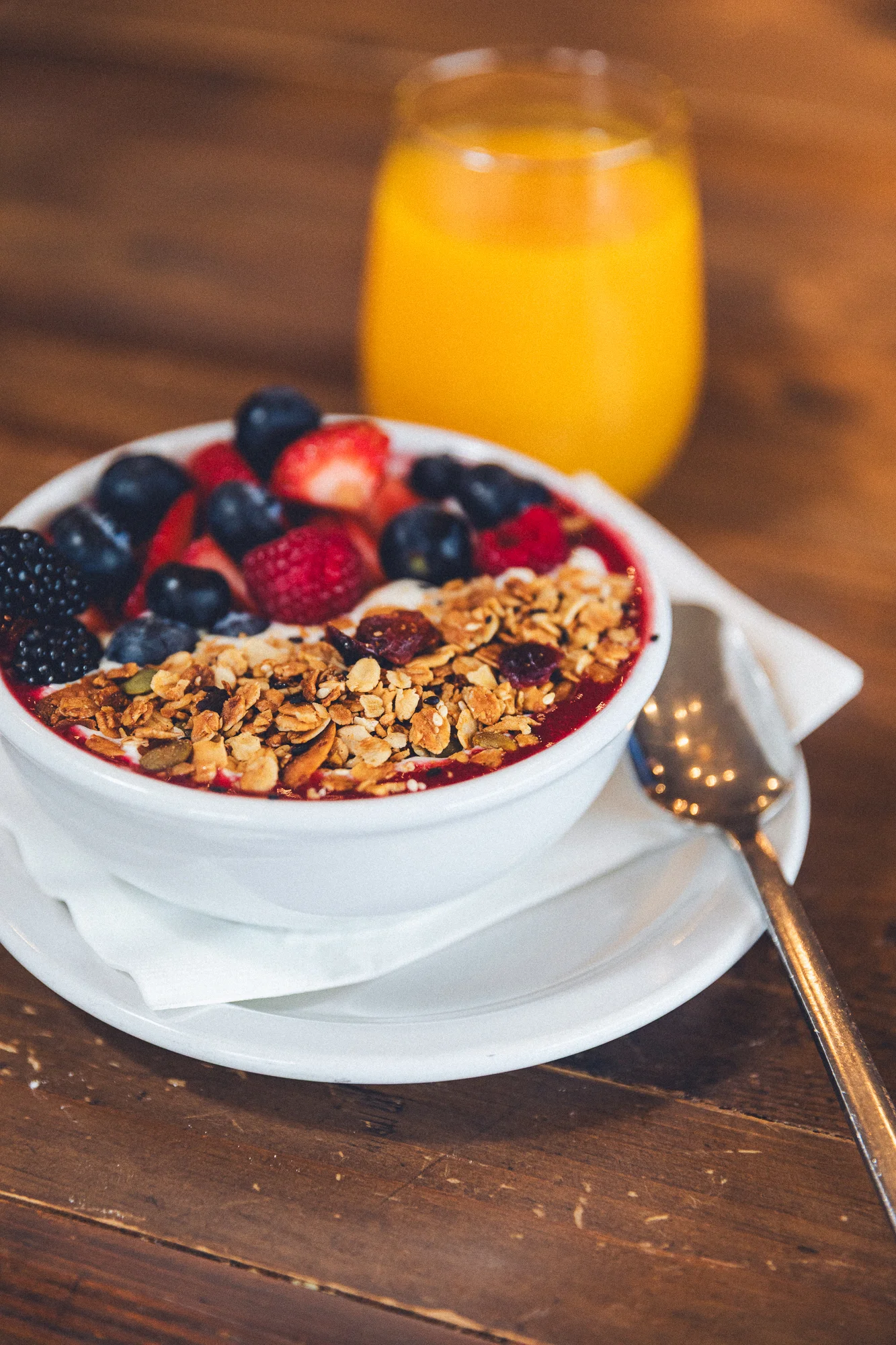 Bowl of granola with mixed berries and yogurt