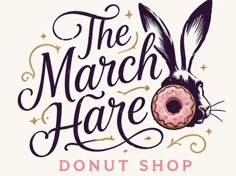 A whimsical logo featuring a hare with a pink donut. The design includes decorative text that reads 'The March Hare Donut Shop'.