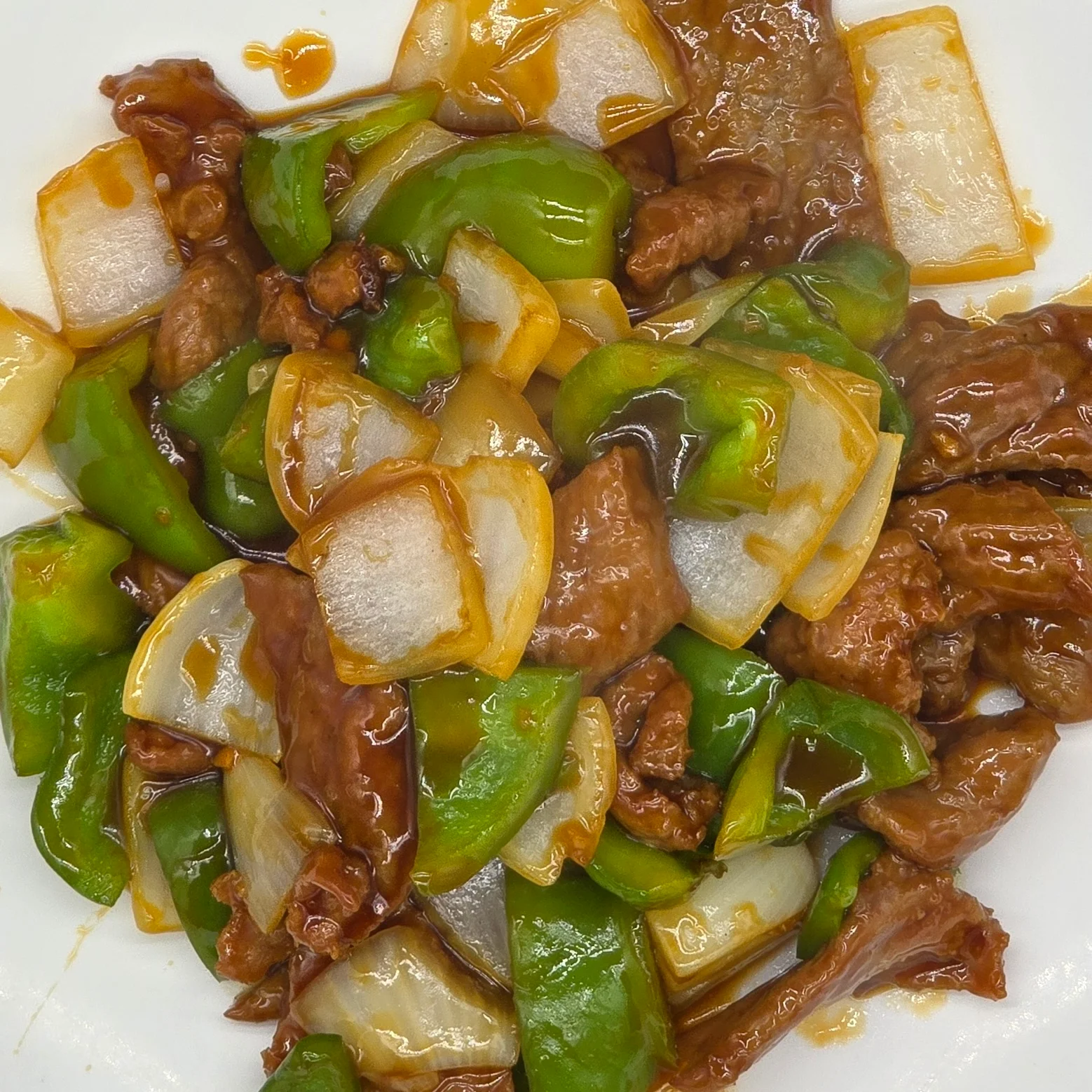 Szechuan beef stir-fry with bell peppers and onions