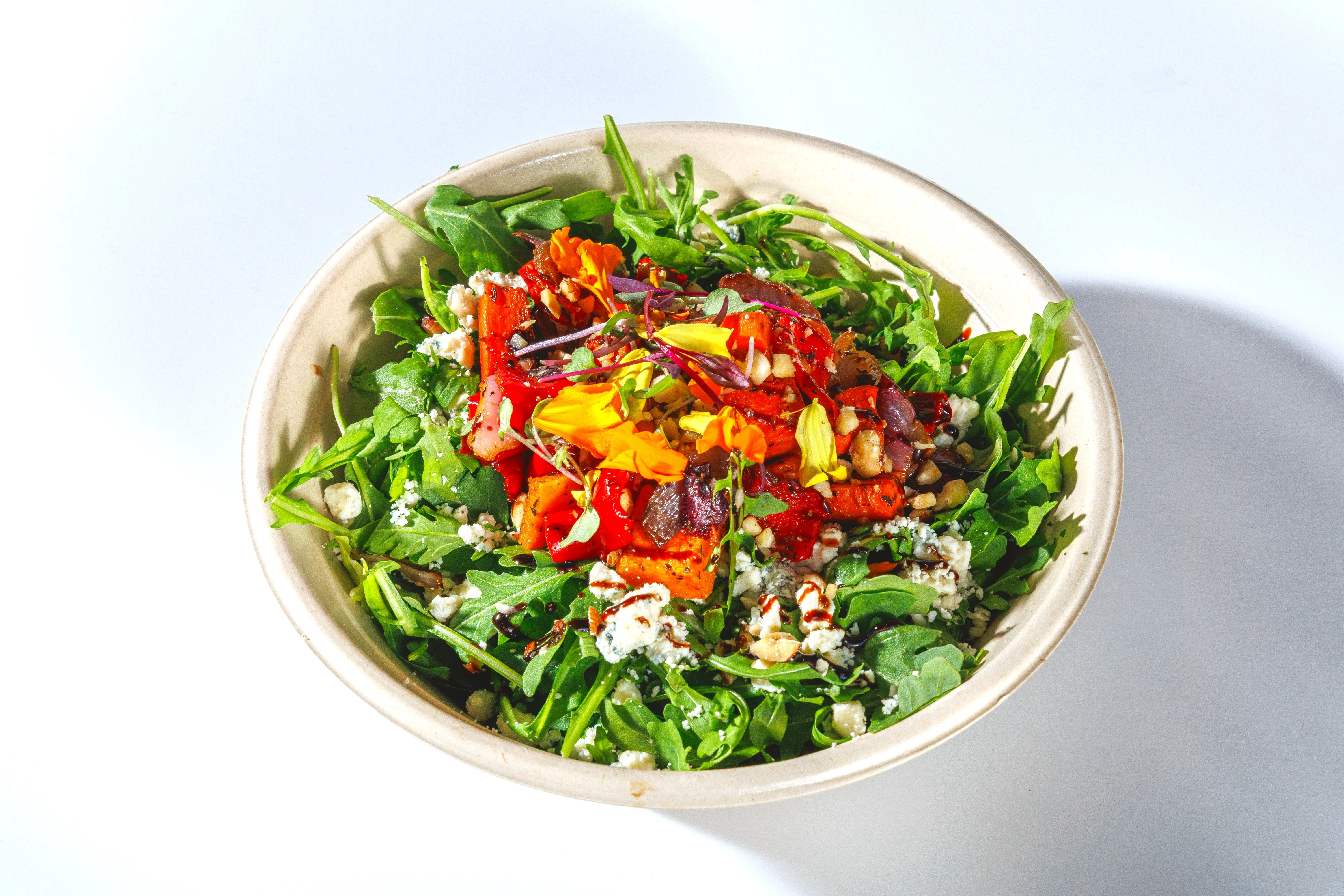 Vibrant arugula salad with roasted vegetables