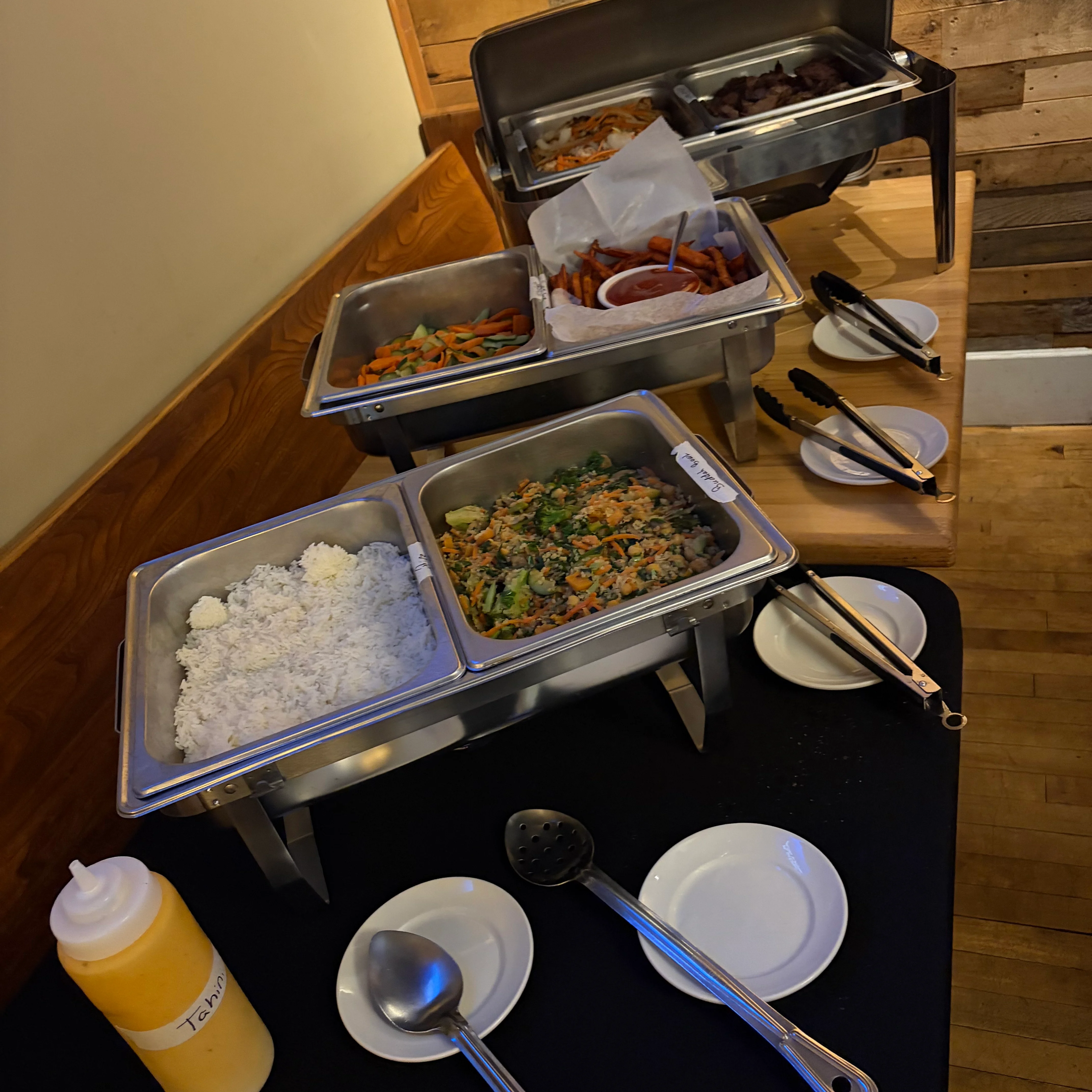 Buffet spread featuring Asian fried rice and sweet potato fries