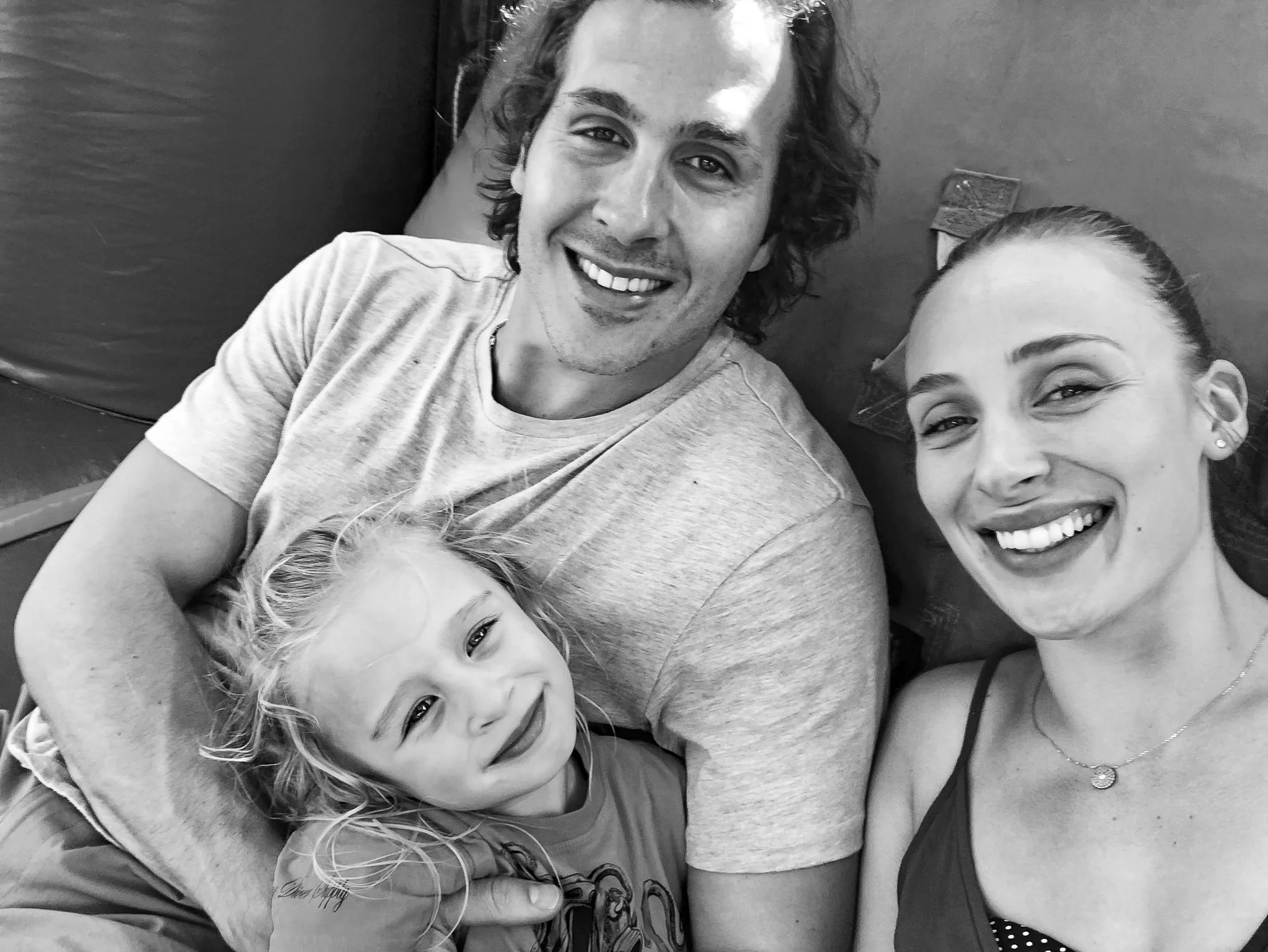 Family enjoying a fun moment together in a playful setting