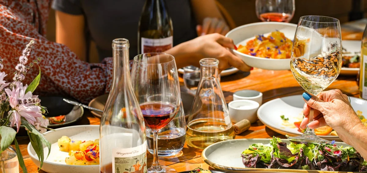 Elegant dining table with assorted dishes and wine