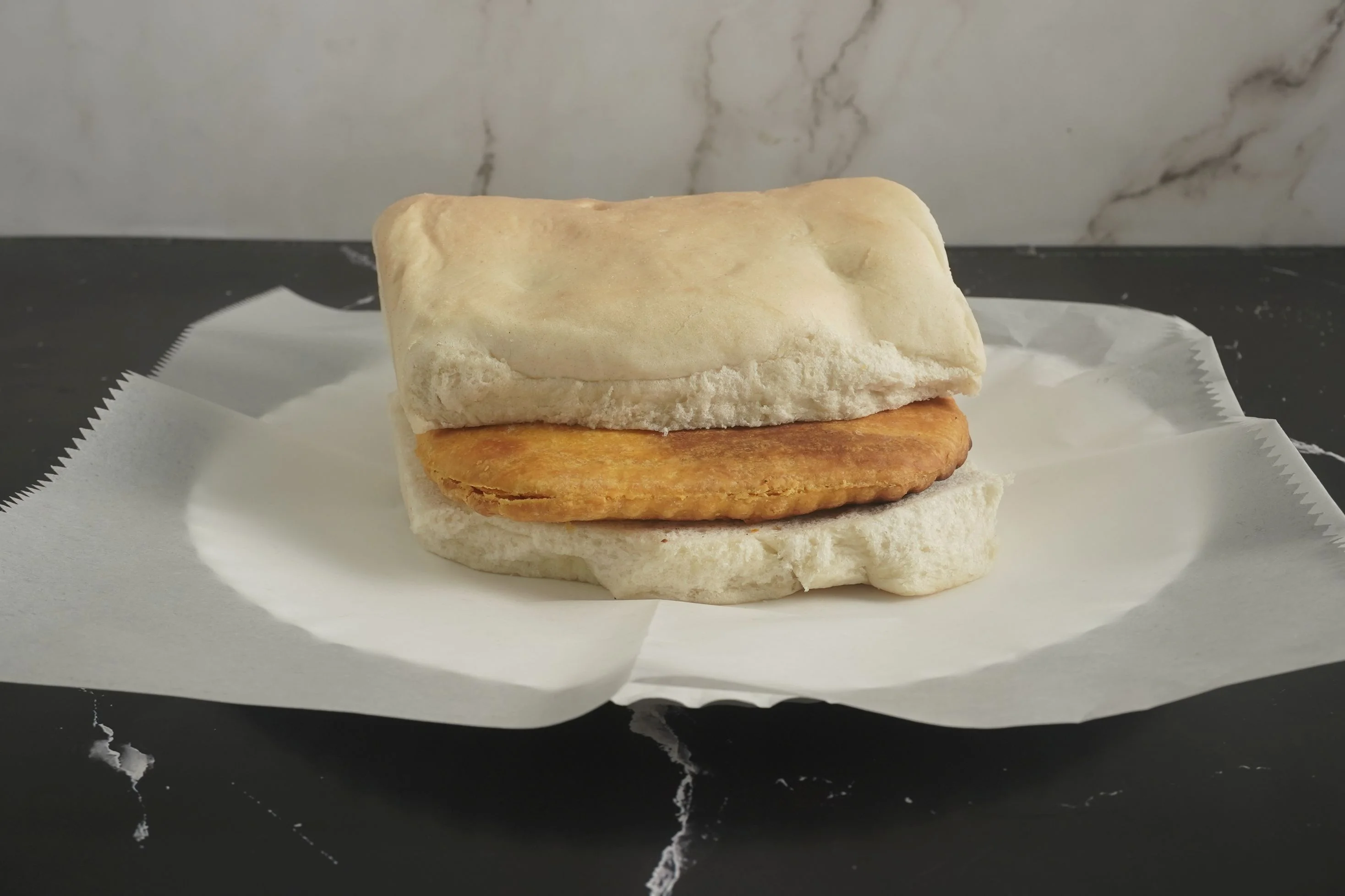 A Golden Crust NY Beef Patty & Buttered CoCo Bread. 