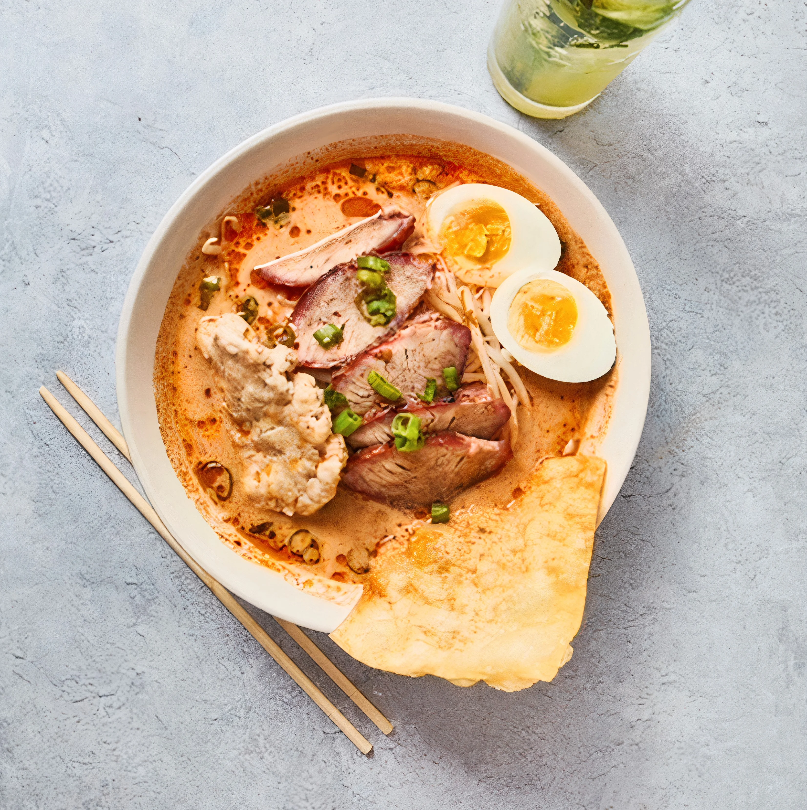 Bowl of Malaysian laksa with noodles and egg
