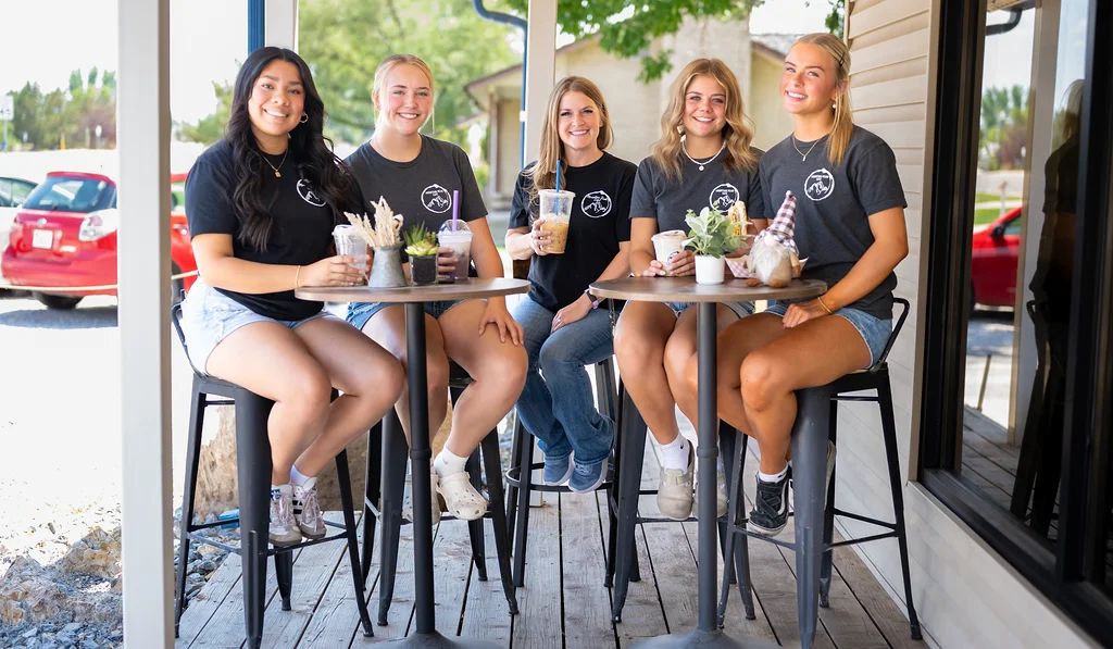 Group of friends enjoying drinks at a cozy café