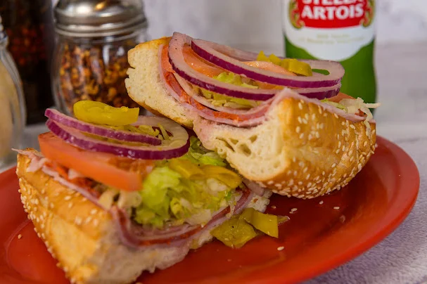 Italian sub sandwich with layers of meats and fresh vegetables