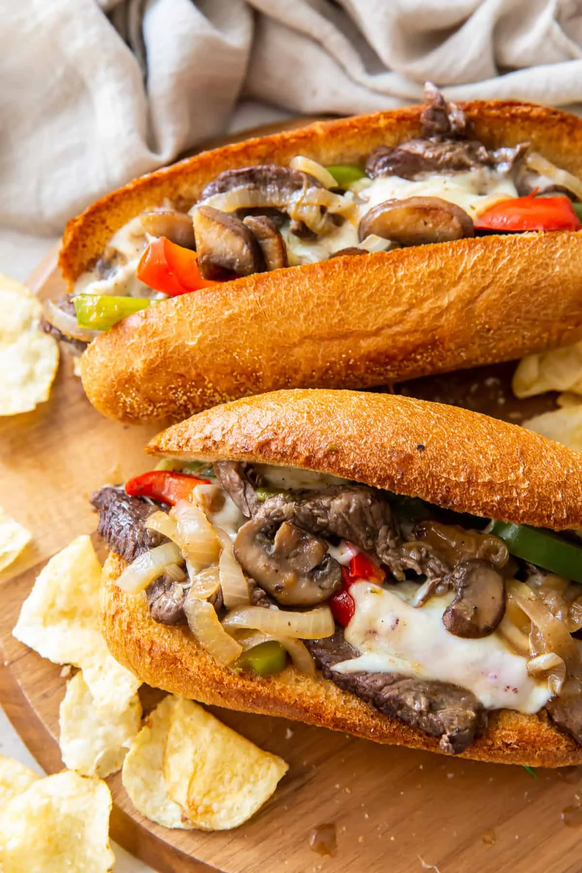 Delicious Philly cheesesteak sandwich with melted cheese and toppings.
