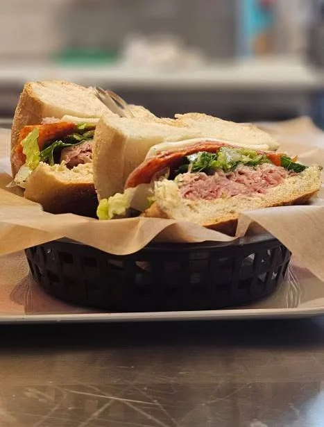 Classic deli sandwich with layers of meat and fresh vegetables