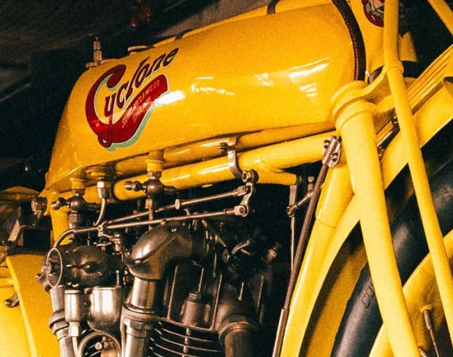 Close-up of a vintage yellow motorcycle engine