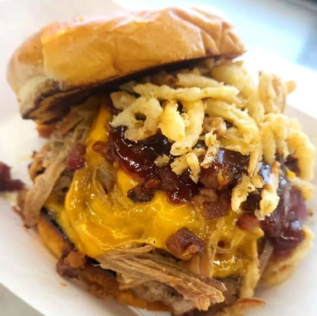Pulled pork cheeseburger with crispy onions