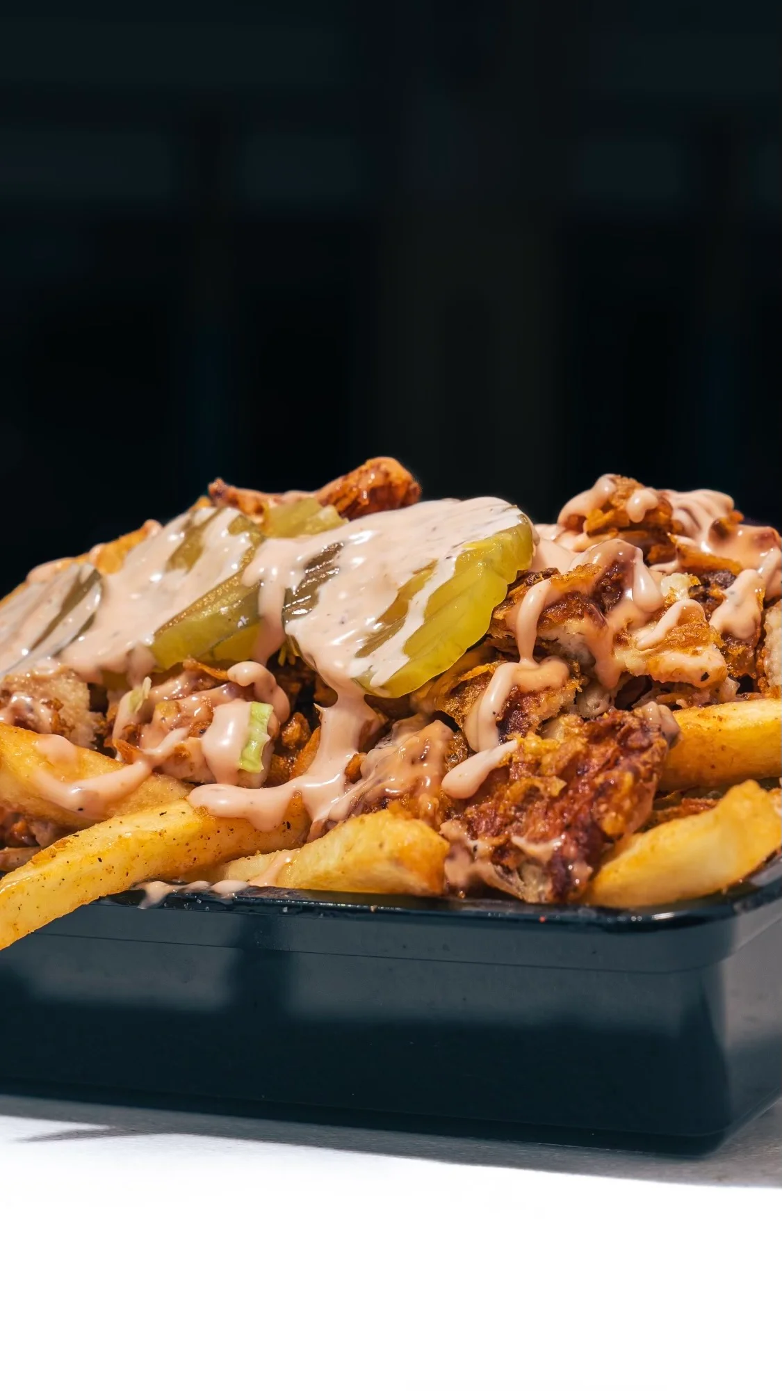A delicious loaded dish topped with various ingredients.