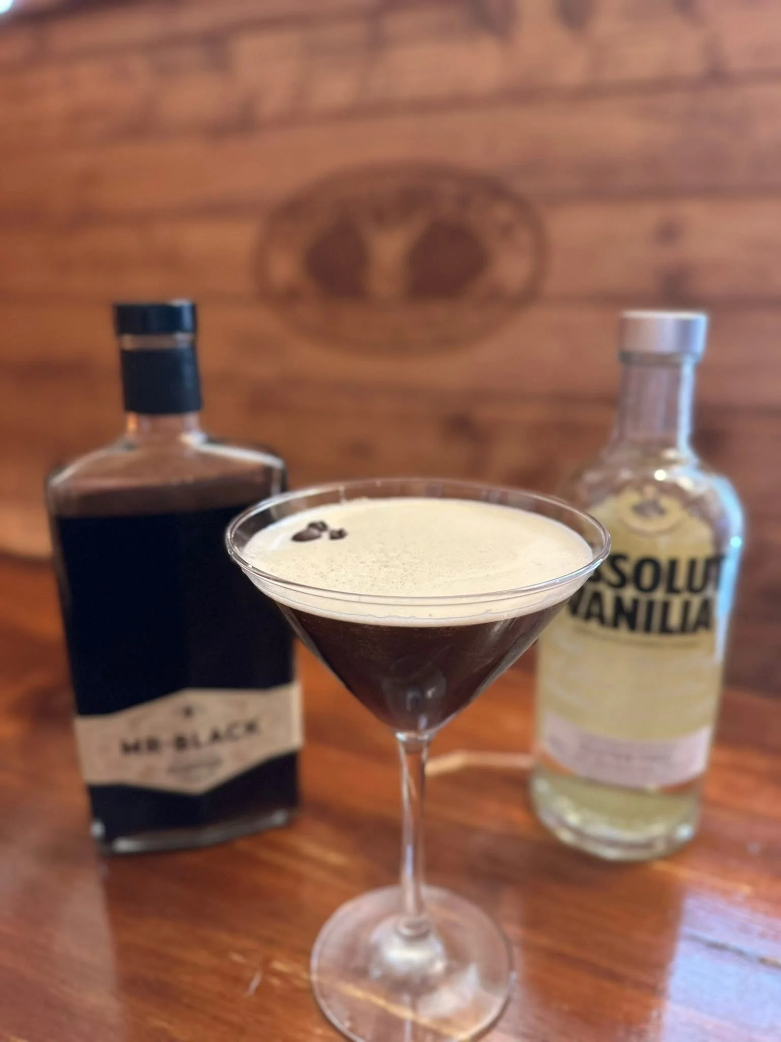 Espresso martini with coffee beans in a cocktail glass