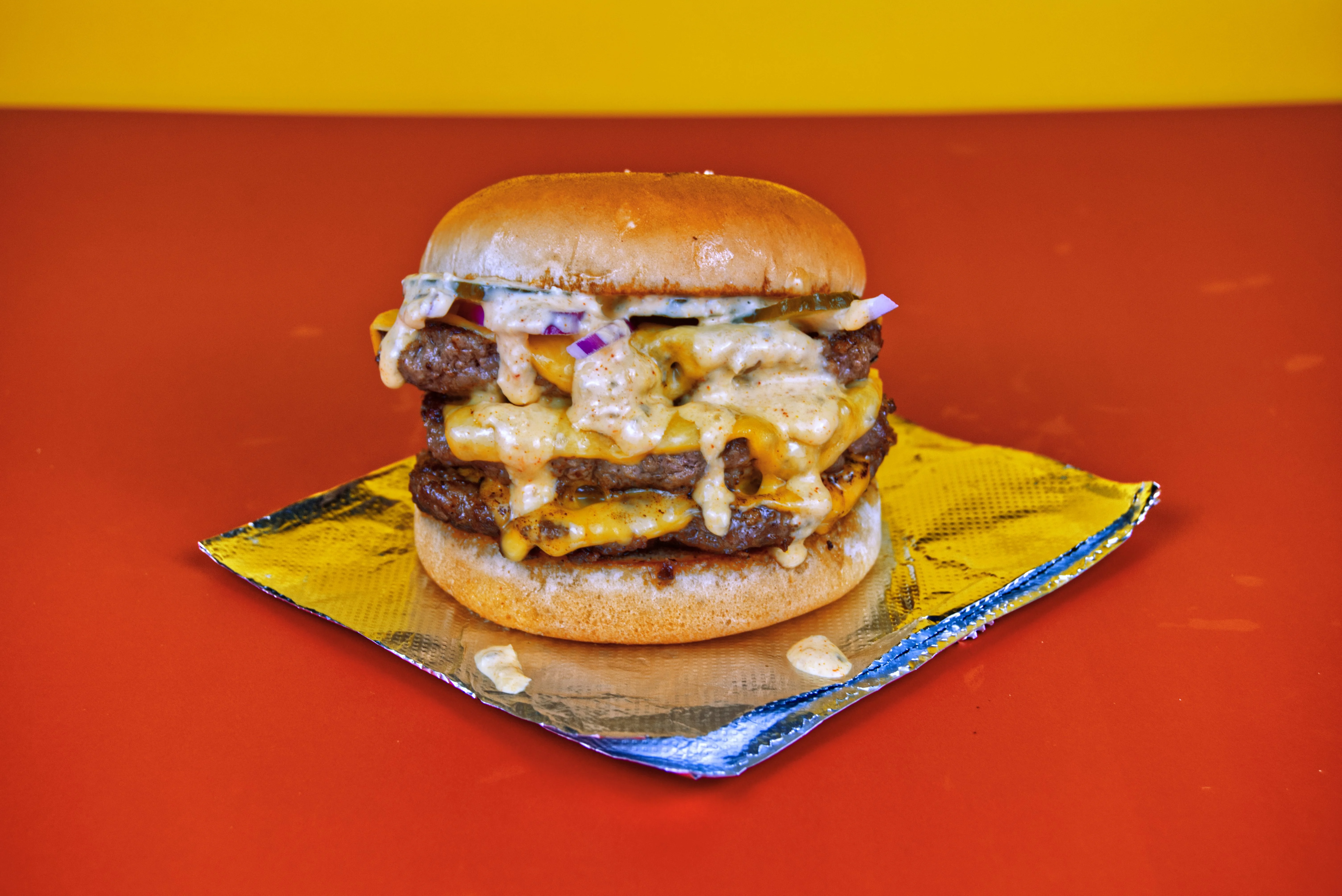 Double cheeseburger with melted cheese and toppings