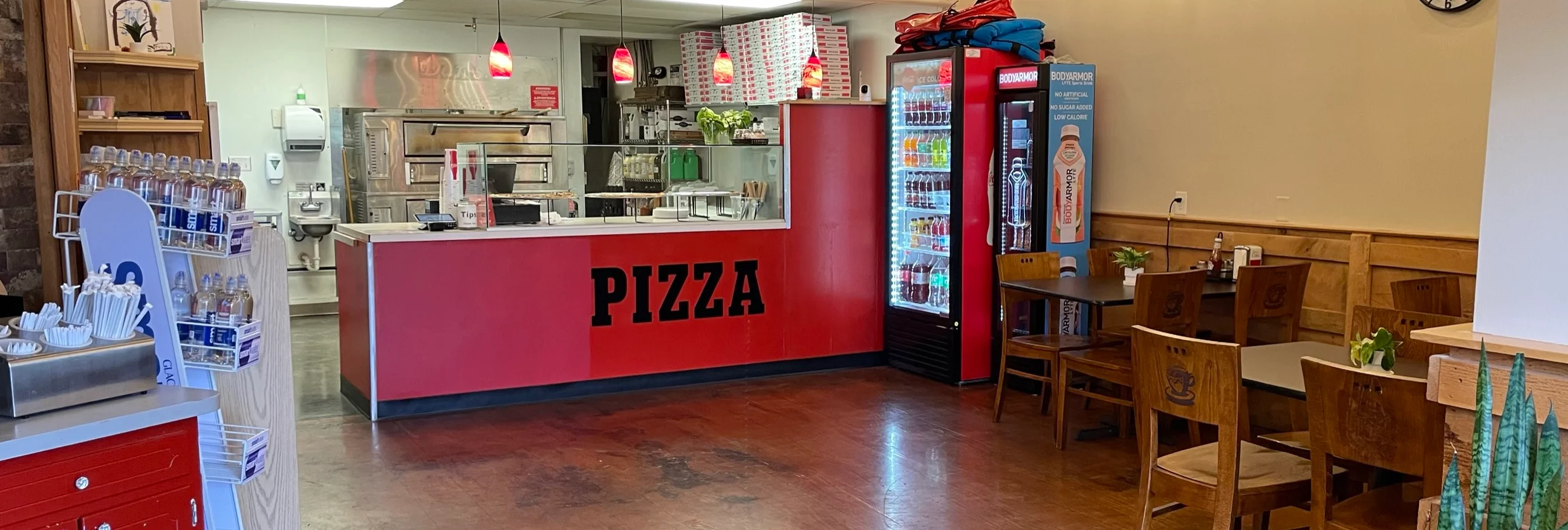 Cozy pizza restaurant interior with red accents