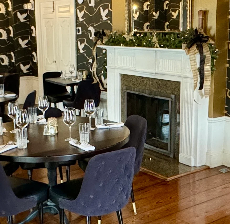 restaurant fire place with main dining table set for the guests