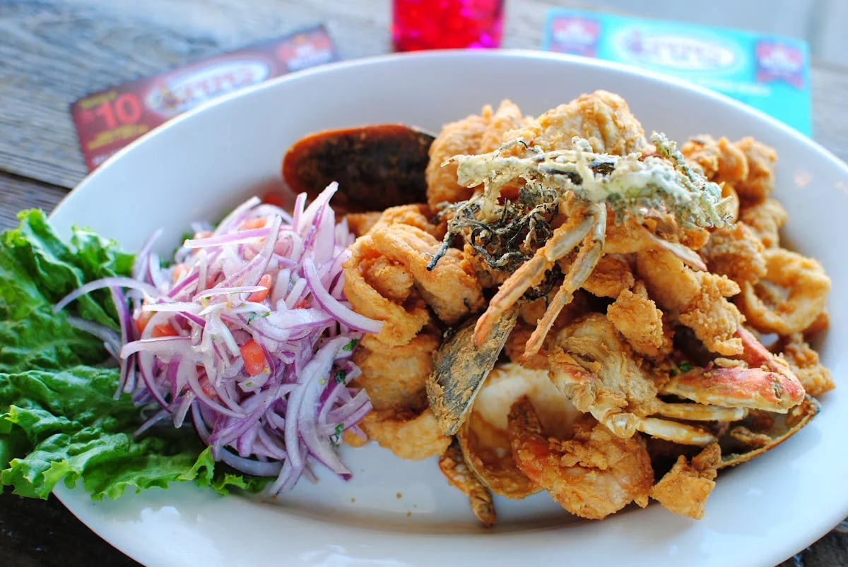 Peruvian fried seafood platter with salad