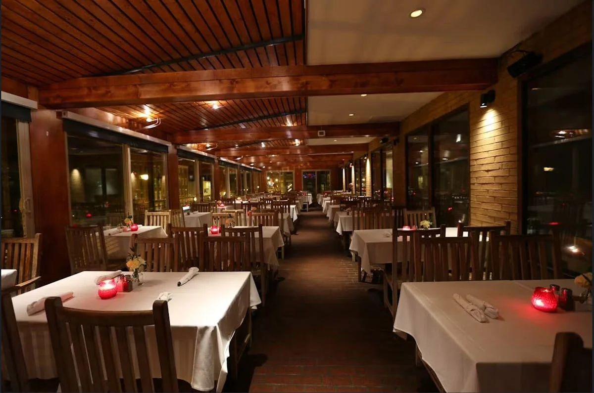 Cozy restaurant interior with warm lighting and wooden decor